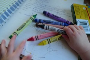 multiple colored crayons being used