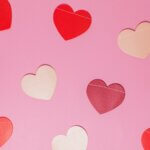 Red, Pink, purple, and white hearts on a pink background